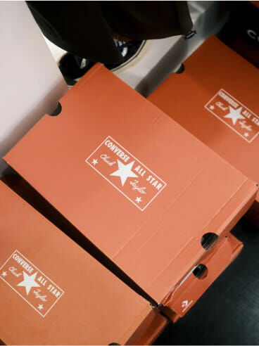 A group of Converse All Star orange boxes sitting next to each other